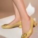 Womens leatherite block heels in light yellow patent with square toe and logo buckle by JULKE