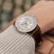 navitimer-41-gmt-a32310211g1p1-white-leather-wrist-shot-ecom